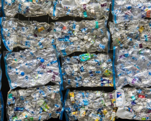 Plastic that has been crushed and moulded into cubes for recyling.